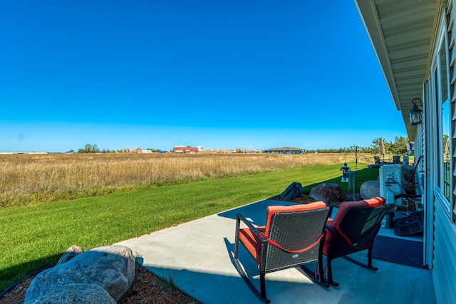 view of patio / terrace with a rural view