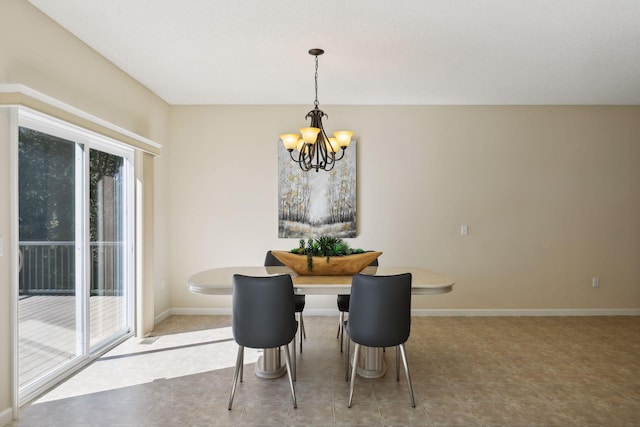 dining space featuring plenty of natural light and a chandelier