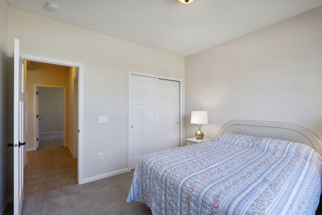 bedroom featuring a closet and carpet floors