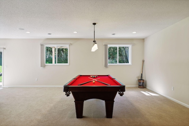 recreation room featuring carpet flooring, a textured ceiling, and pool table