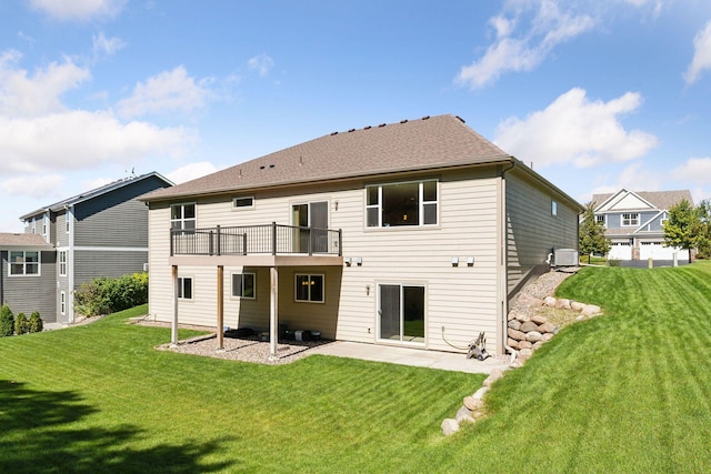 rear view of house with a patio area, a yard, and a deck