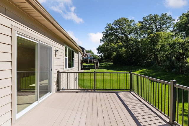 wooden terrace with a yard