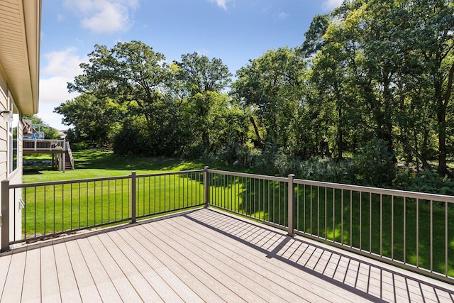 wooden deck with a yard