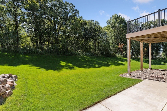 view of yard featuring a wooden deck