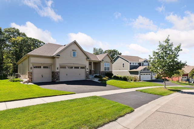 view of front facade featuring a front lawn and a garage