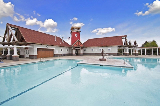 view of swimming pool with a patio