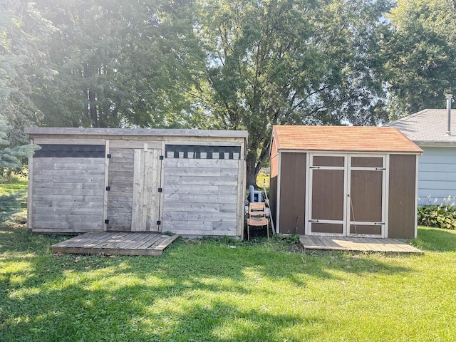 view of outdoor structure featuring a lawn