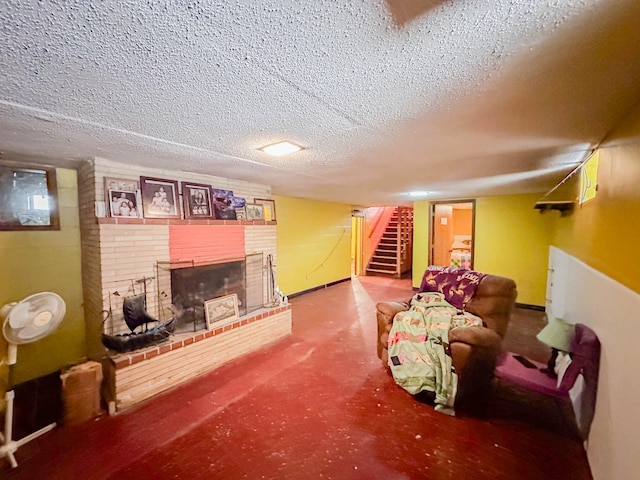 living room featuring a textured ceiling and a fireplace