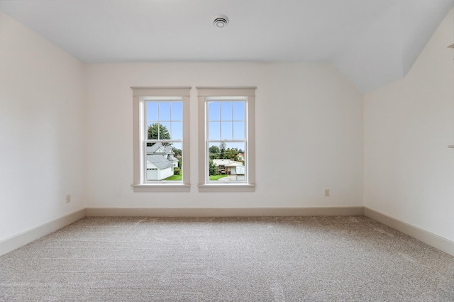 additional living space featuring baseboards, visible vents, and carpet floors