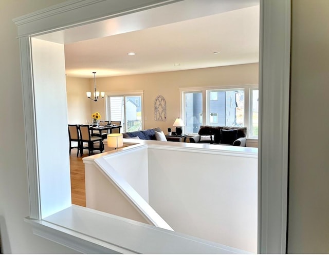 interior space featuring a notable chandelier and hardwood / wood-style flooring