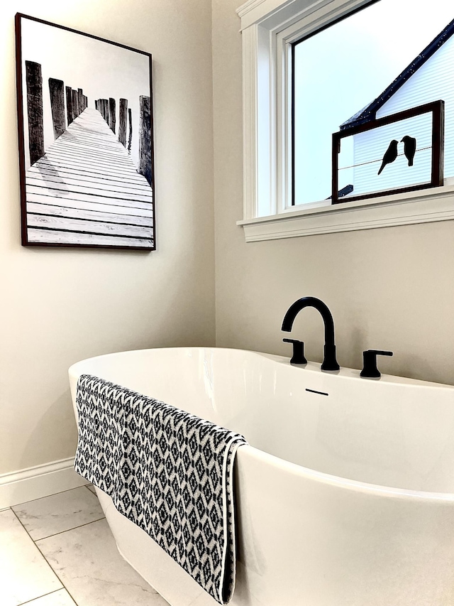 bathroom featuring a tub to relax in