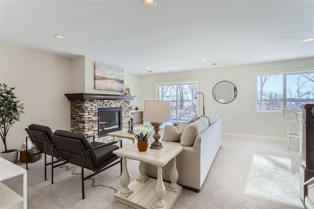 living room with a fireplace and light carpet