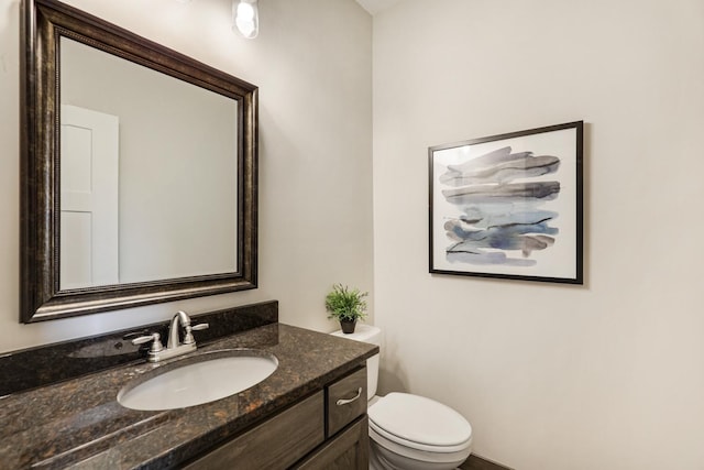 bathroom with toilet and vanity