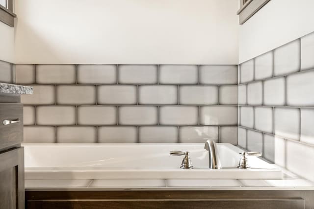 bathroom featuring a tub