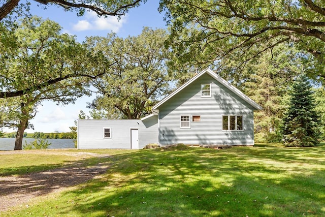 rear view of house with a yard