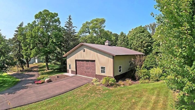 garage featuring a yard