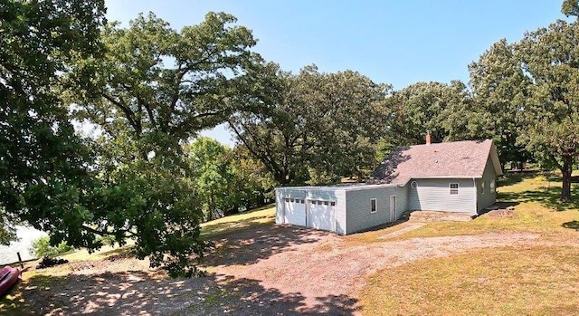 exterior space with a front lawn and a garage