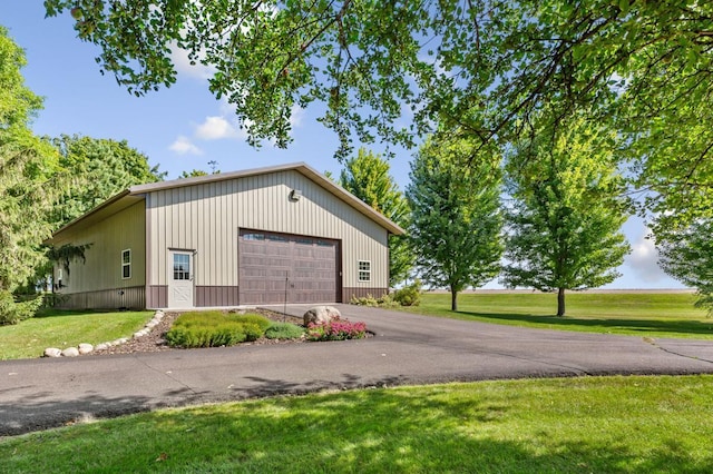 garage featuring a yard