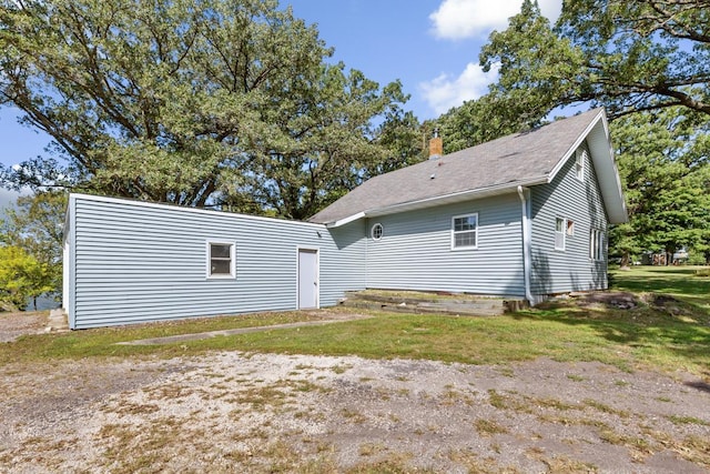 back of house with a yard