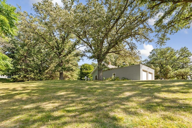 view of yard featuring a garage