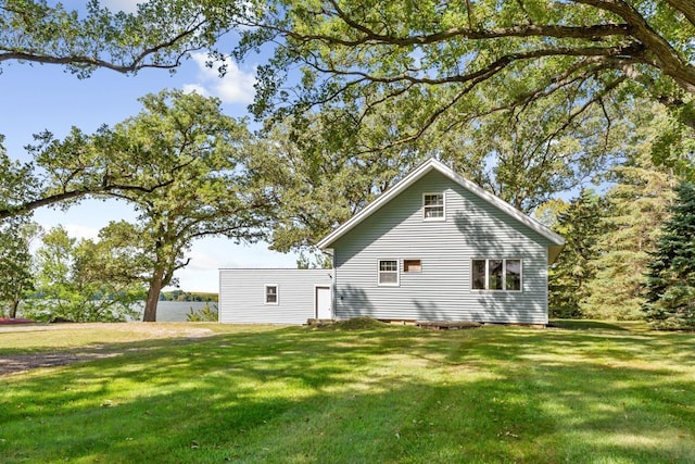 view of home's exterior with a lawn