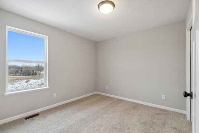 spare room featuring carpet flooring