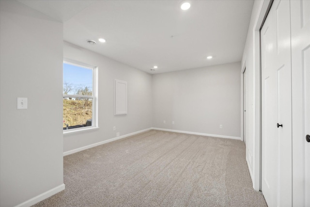 unfurnished bedroom with light carpet