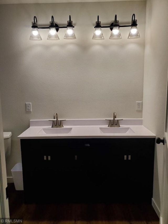 bathroom with vanity and toilet