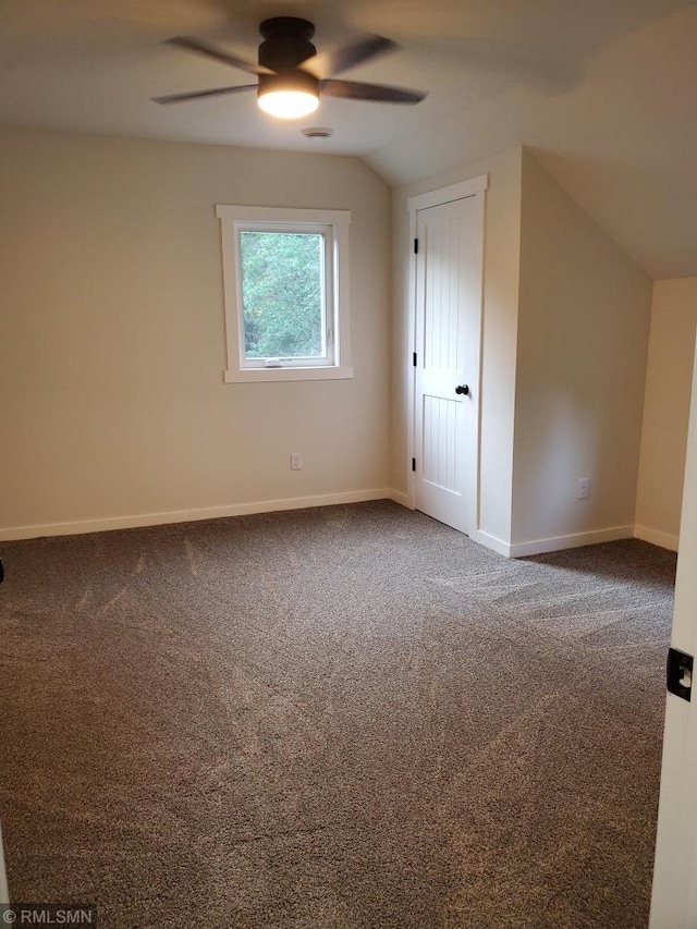 bonus room featuring ceiling fan, carpet floors, and lofted ceiling