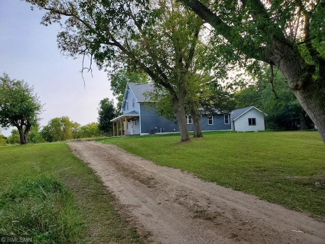 view of side of property with a yard