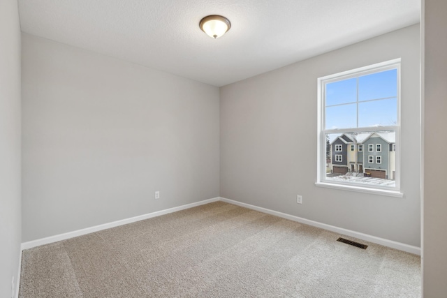 spare room with carpet floors