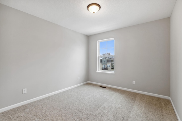 unfurnished room with carpet