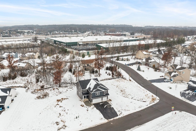 snowy aerial view featuring a residential view