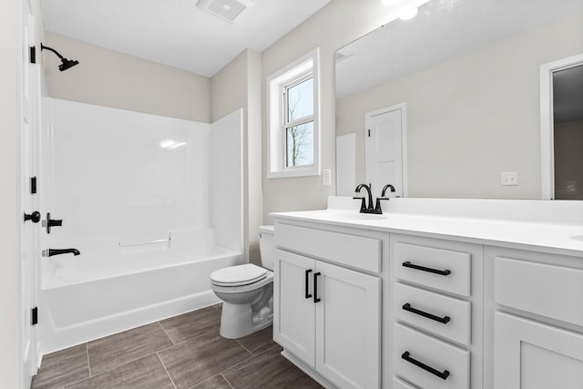 full bathroom with vanity, toilet, and bathing tub / shower combination