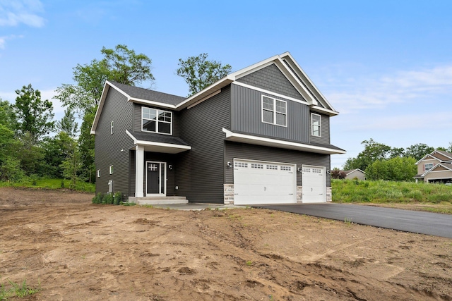 19498 Carson Ct NW, Elk River, MN 55330 - craftsman inspired home with an attached garage and asphalt driveway