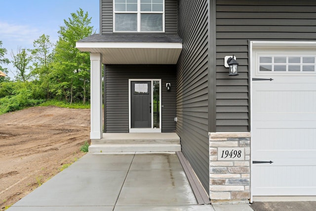 19498 Carson Ct NW, Elk River, MN 55330 - doorway to property with a garage