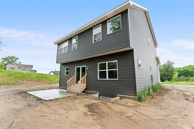 19498 Carson Ct NW, Elk River, MN 55330 - view of front of home featuring entry steps and a patio area
