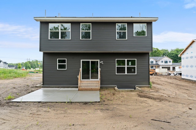 19498 Carson Ct NW, Elk River, MN 55330 - rear view of house featuring entry steps and a patio area