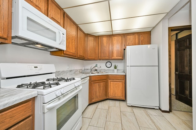 kitchen with white appliances and sink