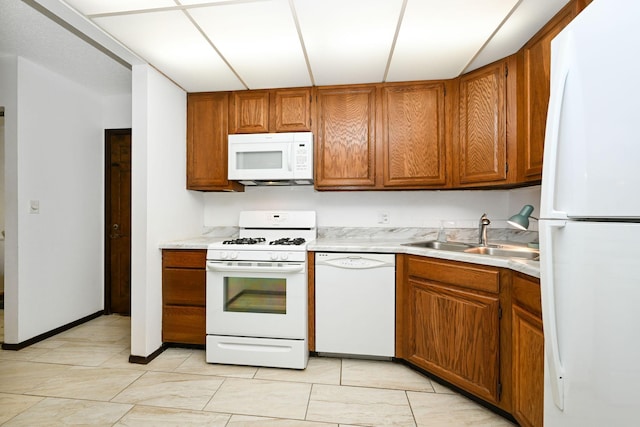 kitchen with sink and white appliances