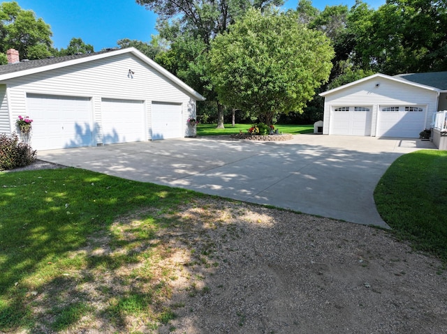 13640 Hagedorn Rd NW, Brandon, MN 56315 - view of home's exterior featuring a lawn, an outbuilding, a chimney, and a detached garage