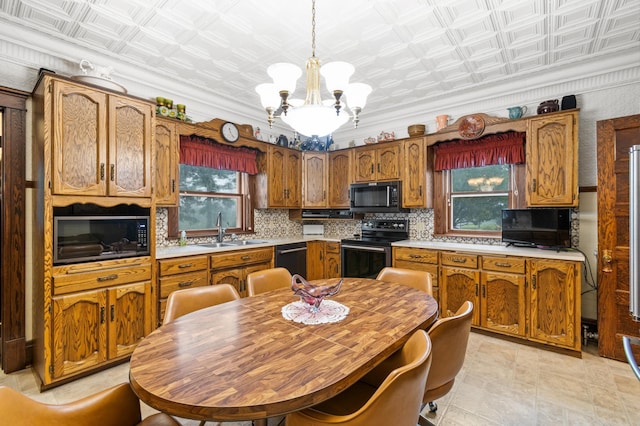 13640 Hagedorn Rd NW, Brandon, MN 56315 - kitchen with a sink, a chandelier, black appliances, and an ornate ceiling