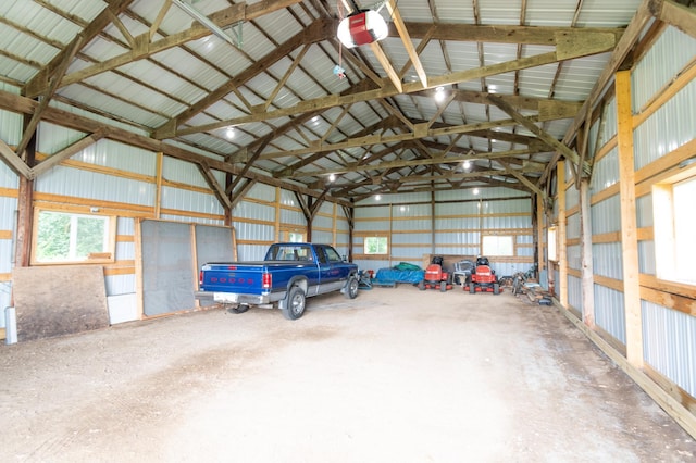 13640 Hagedorn Rd NW, Brandon, MN 56315 - garage featuring a garage door opener and metal wall