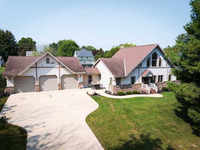 view of front of home with a garage and a front yard