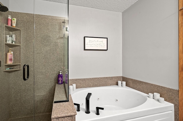 bathroom featuring shower with separate bathtub and a textured ceiling