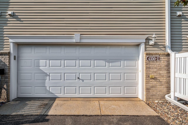 garage with concrete driveway