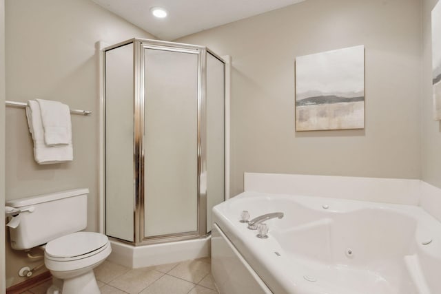 bathroom with toilet, tile patterned floors, and separate shower and tub