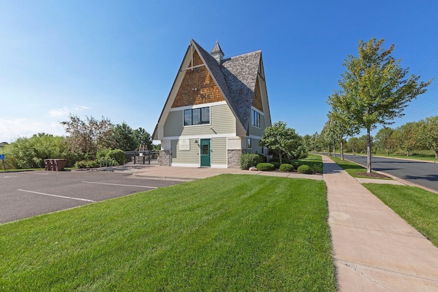 view of side of home featuring a lawn