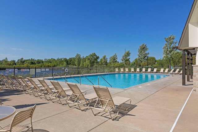 view of swimming pool featuring a patio area