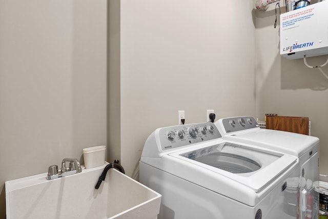 laundry room with sink and washer and dryer